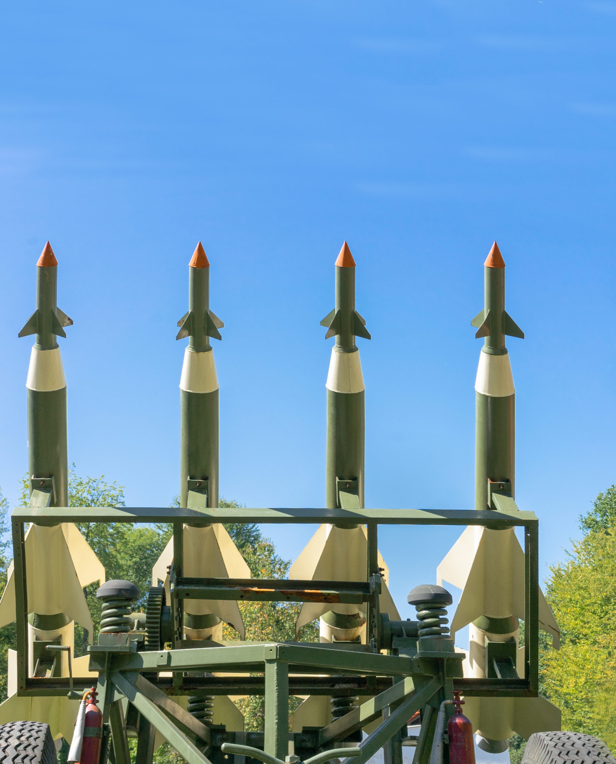 Nuclear Missiles With Warhead Aimed at Gloomy Sky. Balistic Rockets War Backgound.