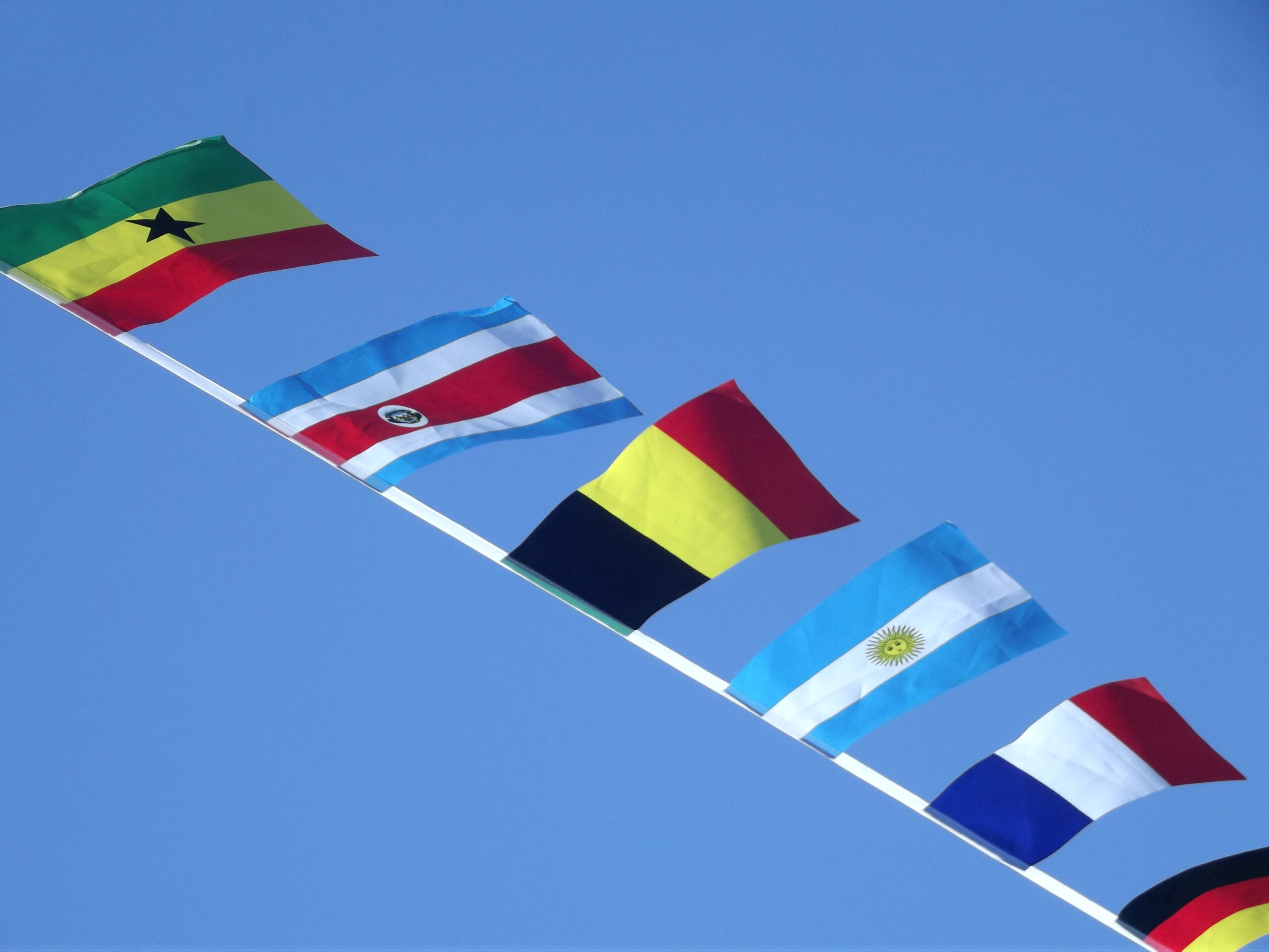 international-flags-against-a-bright-blue-sky-2026-01-06-10-53-37-utc
