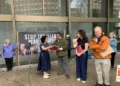 Bahar Sharafi presents the organization's letter to Senator Markey's and Warren's staff.