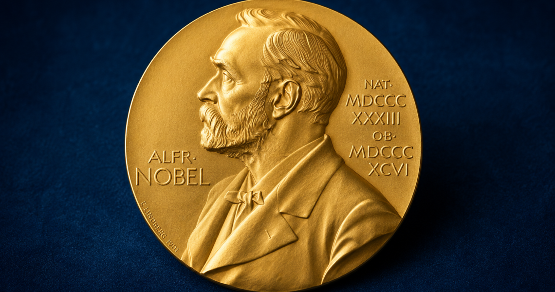 Close-up of the Nobel Prize medal featuring the profile portrait of Alfred Nobel engraved in gold.