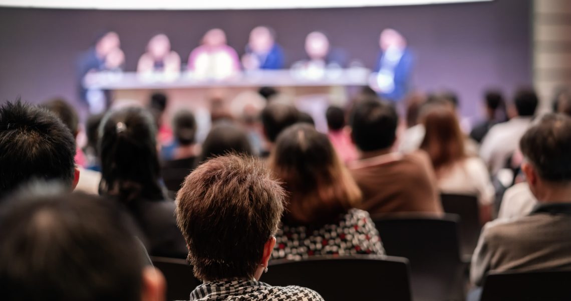 Rear view of Audience in the conference hall or seminar meeting which have Speakers are Brainstorming