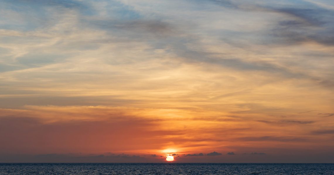 Sunset on the tropical sea beach.