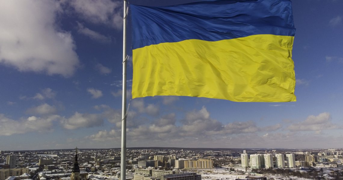Ukrainian flag in the wind. Blue Yellow flag in the city of Kharkov